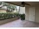 Private patio with tile flooring and lush landscaping at 4200 N Miller Rd # 112, Scottsdale, AZ 85251