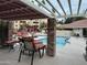 Inviting pool area with lounge chairs and a covered patio at 4200 N Miller Rd # 112, Scottsdale, AZ 85251