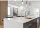 Modern kitchen island with white countertop and a sleek faucet at 4220 N 32Nd St # 32, Phoenix, AZ 85018