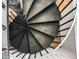 Modern spiral staircase with metal railings, leading to upper levels at 4220 N 32Nd St # 32, Phoenix, AZ 85018