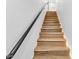 Modern light wood staircase with dark metal railing at 4220 N 32Nd St # 32, Phoenix, AZ 85018