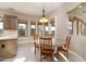 Bright kitchen nook features a table for four and views to the backyard at 4332 S Primrose Dr, Gold Canyon, AZ 85118