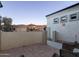 Side yard view with a stone patio and mountain backdrop at 4332 S Primrose Dr, Gold Canyon, AZ 85118