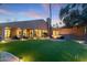 Expansive backyard with fire pit and artificial turf at 4450 E Camelback Rd # 4, Phoenix, AZ 85018