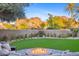 Landscaped backyard with fire pit and mountain views at 4450 E Camelback Rd # 4, Phoenix, AZ 85018