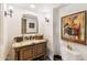 Powder room with granite vanity and artwork at 4450 E Camelback Rd # 4, Phoenix, AZ 85018