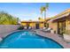 Inviting kidney-shaped pool with surrounding patio at 4450 E Camelback Rd # 4, Phoenix, AZ 85018