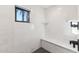 Spa-like shower with marble tile and built-in bench at 4450 E Camelback Rd # 4, Phoenix, AZ 85018