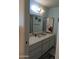 Bathroom with single sink vanity and mirrored medicine cabinet at 5110 E Edgewood Ave, Mesa, AZ 85206