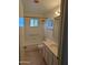 Bathroom with tub, shower, and vanity at 5110 E Edgewood Ave, Mesa, AZ 85206