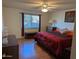 Spacious bedroom with large window and wood flooring at 5110 E Edgewood Ave, Mesa, AZ 85206