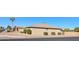 Side view of a light brown brick ranch style home with desert landscaping at 5110 E Edgewood Ave, Mesa, AZ 85206