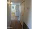 Hallway with light wood flooring and linen closet at 5110 E Edgewood Ave, Mesa, AZ 85206