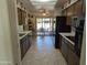 Eat-in kitchen with tile floor and access to backyard patio at 5110 E Edgewood Ave, Mesa, AZ 85206