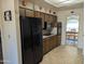 Kitchen with black appliances and ample wood cabinets at 5110 E Edgewood Ave, Mesa, AZ 85206