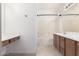 Main bathroom with a bathtub, double sinks, and tiled floor at 5331 E Holmes Ave, Mesa, AZ 85206