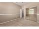 Spacious bedroom featuring mirrored closet doors and neutral wall colors at 5331 E Holmes Ave, Mesa, AZ 85206