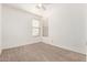 Well-lit bedroom with carpeted floors, window blinds, and a ceiling fan at 5331 E Holmes Ave, Mesa, AZ 85206