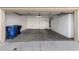 Two-car garage with extra storage cabinets and epoxy flooring at 5331 E Holmes Ave, Mesa, AZ 85206