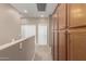 Upstairs hallway with two doors and built-in wooden cabinets at 5331 E Holmes Ave, Mesa, AZ 85206