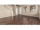 Living room with hardwood floors and a staircase at 5331 E Holmes Ave, Mesa, AZ 85206