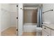 Bathroom with tub, toilet and walk-in closet at 5345 E Van Buren St # 226, Phoenix, AZ 85008