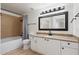 Bathroom with granite vanity, tub, and shower at 5345 E Van Buren St # 226, Phoenix, AZ 85008