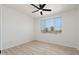 Bright bedroom with wood flooring and ceiling fan at 5345 E Van Buren St # 226, Phoenix, AZ 85008