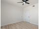 Bright bedroom with ceiling fan and laminate flooring at 5345 E Van Buren St # 226, Phoenix, AZ 85008