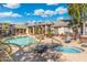 Community pool and spa with lounge chairs; perfect for relaxation at 5345 E Van Buren St # 226, Phoenix, AZ 85008