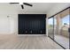 Living room with modern wall paneling and sliding door to balcony at 5345 E Van Buren St # 226, Phoenix, AZ 85008