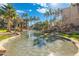 Community pond with waterfall and lush foliage at 5345 E Van Buren St # 226, Phoenix, AZ 85008