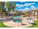 Community pool and spa with lounge chairs at 5345 E Van Buren St # 226, Phoenix, AZ 85008