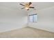 Bright bedroom with carpeted floor, large window, and ceiling fan at 544 N Alma School Rd # 9, Mesa, AZ 85201