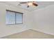 Simple bedroom with ceiling fan and window blinds at 544 N Alma School Rd # 9, Mesa, AZ 85201