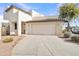 Front view of a two-story house with a garage and driveway at 544 N Alma School Rd # 9, Mesa, AZ 85201