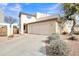 Two-story stucco home with a two-car garage and desert landscaping at 544 N Alma School Rd # 9, Mesa, AZ 85201