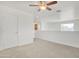 Spacious loft area with carpeted floor, window, and door to hallway at 544 N Alma School Rd # 9, Mesa, AZ 85201