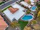 Overhead view of a well-maintained home showcasing its backyard oasis with a pool and putting green at 6320 E Kings Ave, Scottsdale, AZ 85254