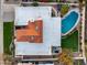 Aerial view of the house featuring a unique roof and a private backyard with a pool at 6320 E Kings Ave, Scottsdale, AZ 85254