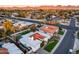 Aerial view of a neighborhood showcasing lush landscaping, swimming pools, and well-maintained homes at 6320 E Kings Ave, Scottsdale, AZ 85254