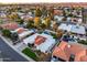 Beautiful aerial view of the house in a community surrounded by palm trees, pools and green grass at 6320 E Kings Ave, Scottsdale, AZ 85254