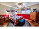 Cozy bedroom with striped bedding, classic wood furniture, and matching whale decorations at 6320 E Kings Ave, Scottsdale, AZ 85254