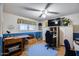 Bright bedroom with natural light from large window, fan, and new hardwood floors at 6320 E Kings Ave, Scottsdale, AZ 85254