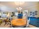 Bright dining area with charming chandelier and views into the living room and kitchen at 6320 E Kings Ave, Scottsdale, AZ 85254