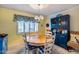 Dining area with a round table, four chairs, and a blue hutch at 6320 E Kings Ave, Scottsdale, AZ 85254