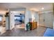 Open foyer featuring tiled floors, a decorative vase, and view into main bedroom at 6320 E Kings Ave, Scottsdale, AZ 85254