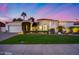 Charming single-story home with lush landscaping, arched entry, and a two-car garage at 6320 E Kings Ave, Scottsdale, AZ 85254