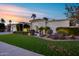 Charming single-story home with lush landscaping, arched entry, and a two-car garage at 6320 E Kings Ave, Scottsdale, AZ 85254