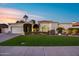 Charming single-story home with lush landscaping, arched entry, and a two-car garage at 6320 E Kings Ave, Scottsdale, AZ 85254